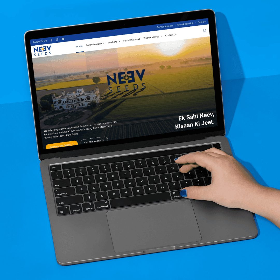 Neev Seeds website home page on a laptop
